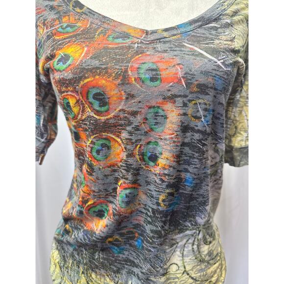 H.I.P, short sleeve multi design top. Fits like S-M
Pit to pit 18. Length 28 - Picture 2 of 5